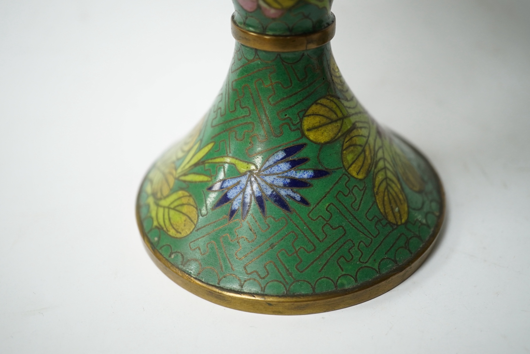 A pair of Chinese champleve enamel floral jars and covers, 22cm high. Condition - good